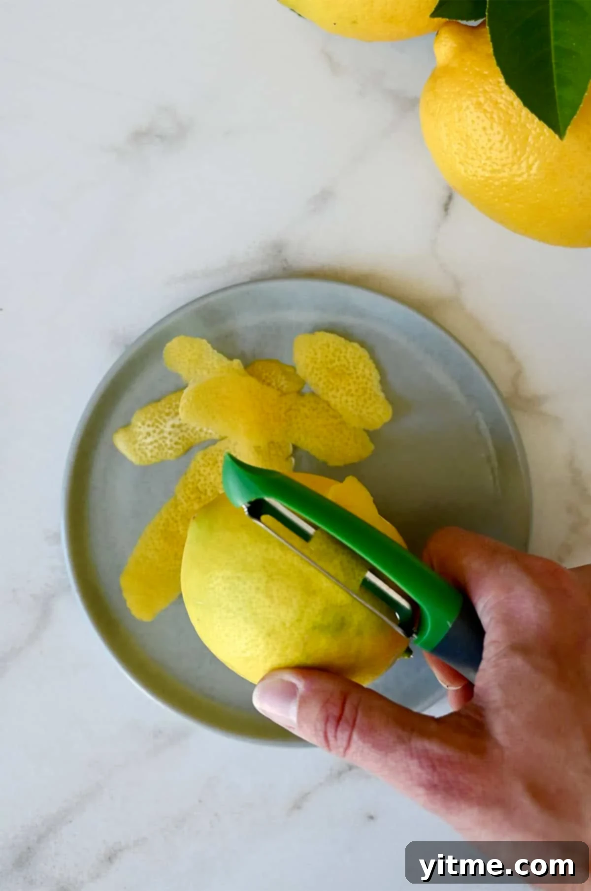 Zesting Lemons: A Citrus Twist Guide 6 Step-by-step instructions for zesting a lemon using a vegetable peeler.