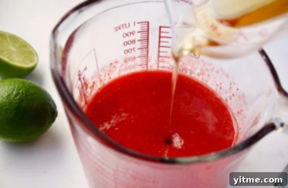 Pouring Tequila into Strawberry Puree