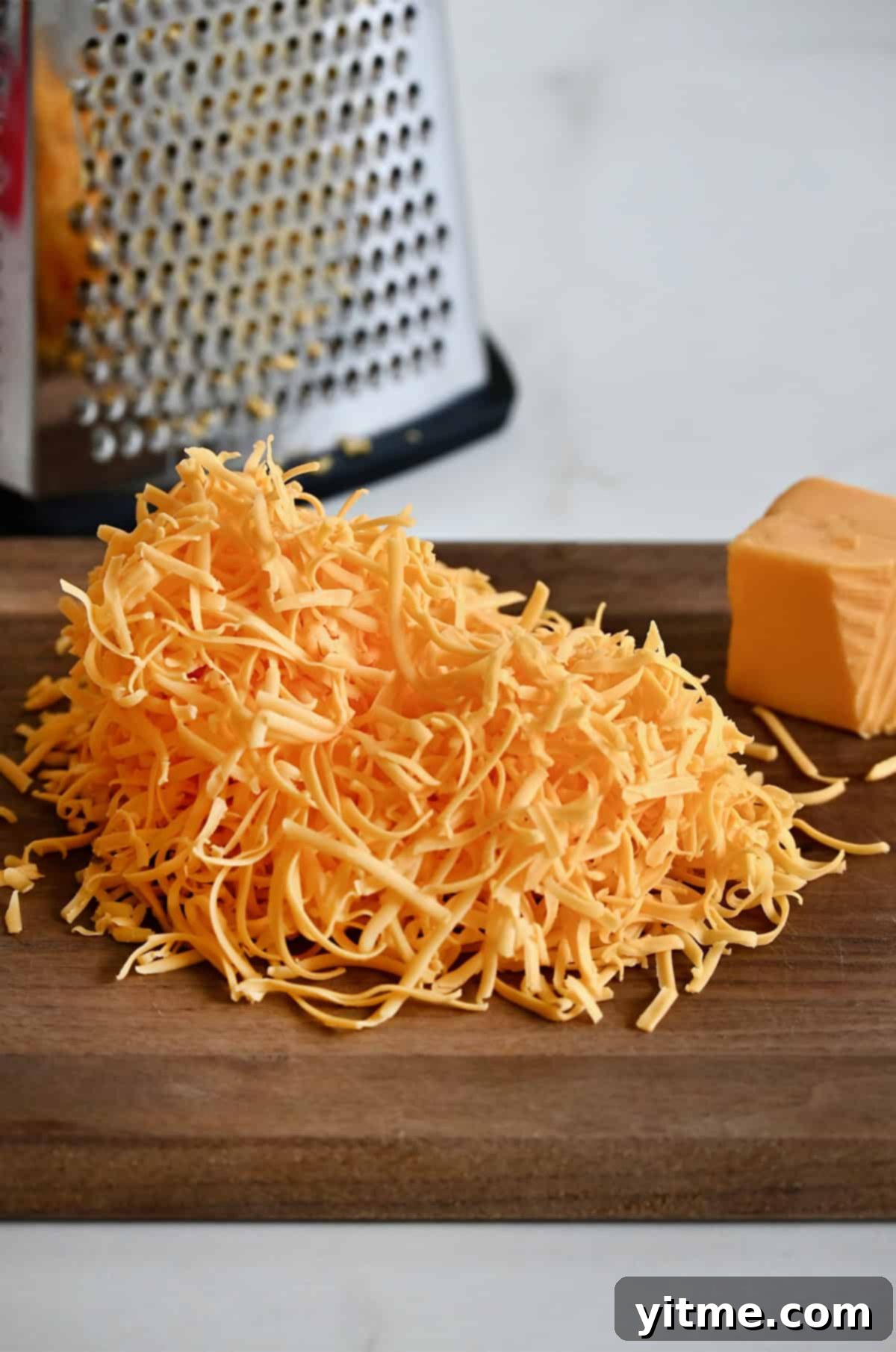 Freshly shredded cheddar cheese