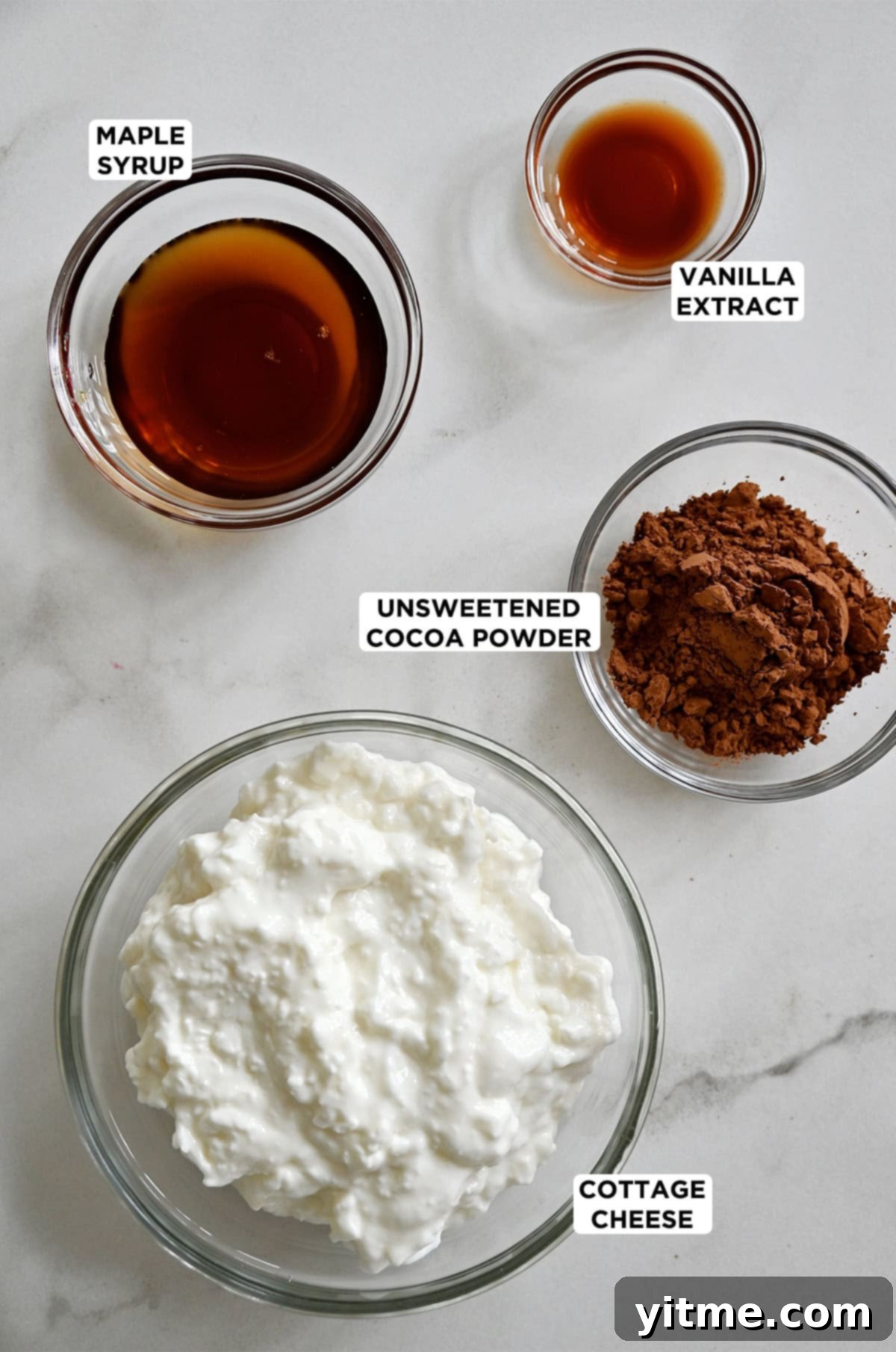 Small glass bowls containing the ingredients for Cottage Cheese Mousse with labels