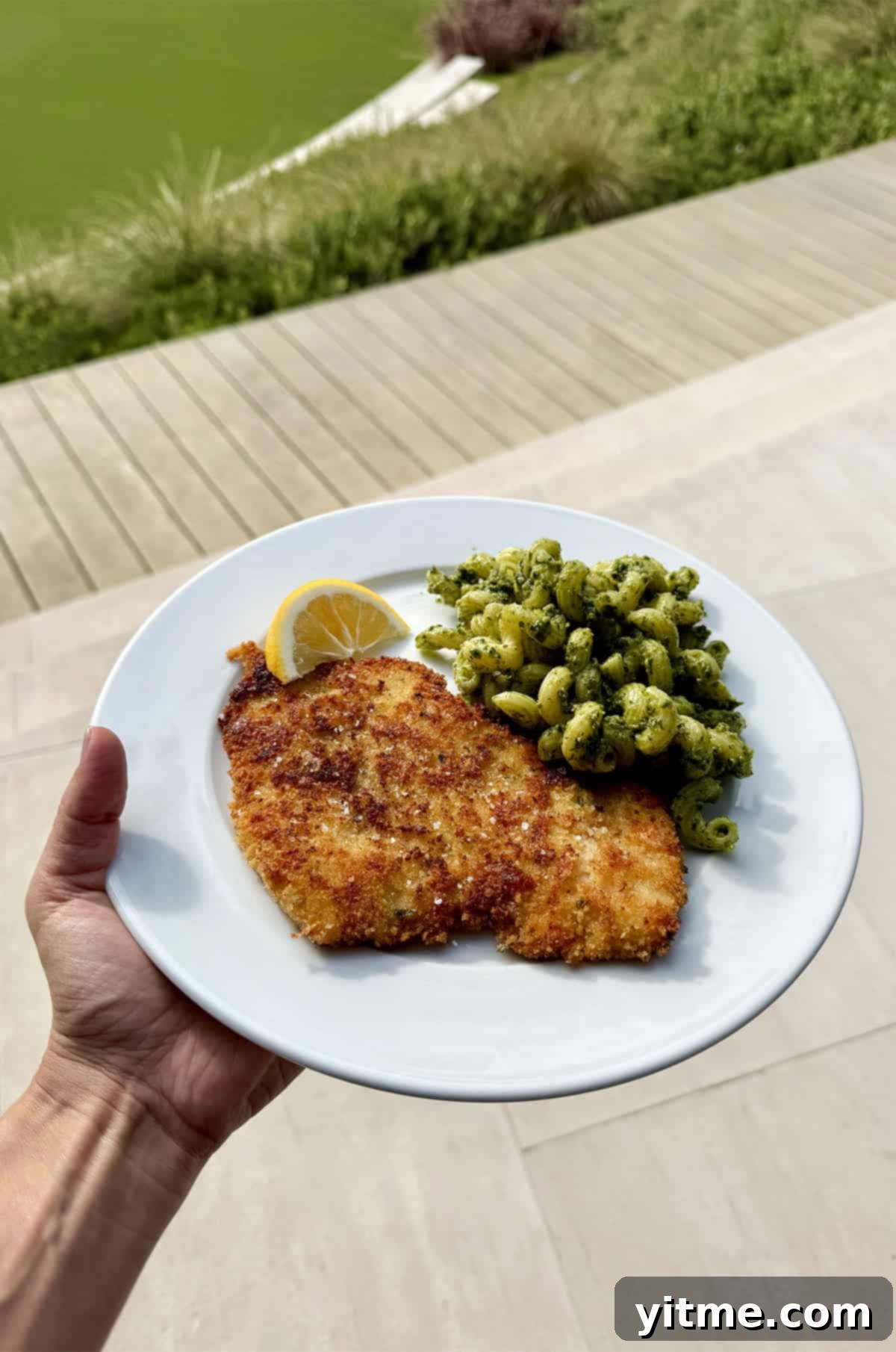 Kelly's Monthly Edit: July 2025 10 A vibrant close-up of fresh, homemade basil pesto, showcasing its rich green color and rustic texture, ready to be tossed with pasta or used as a spread.
