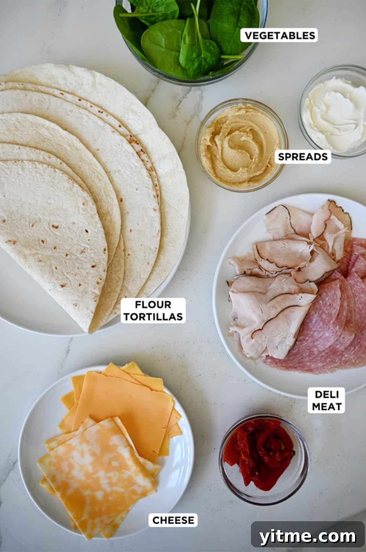 Swirl Sandwiches 3 Ingredients for pinwheel sandwiches: flour tortillas, deli meat, cheese, spinach, mayonnaise, mustard, roasted red peppers.