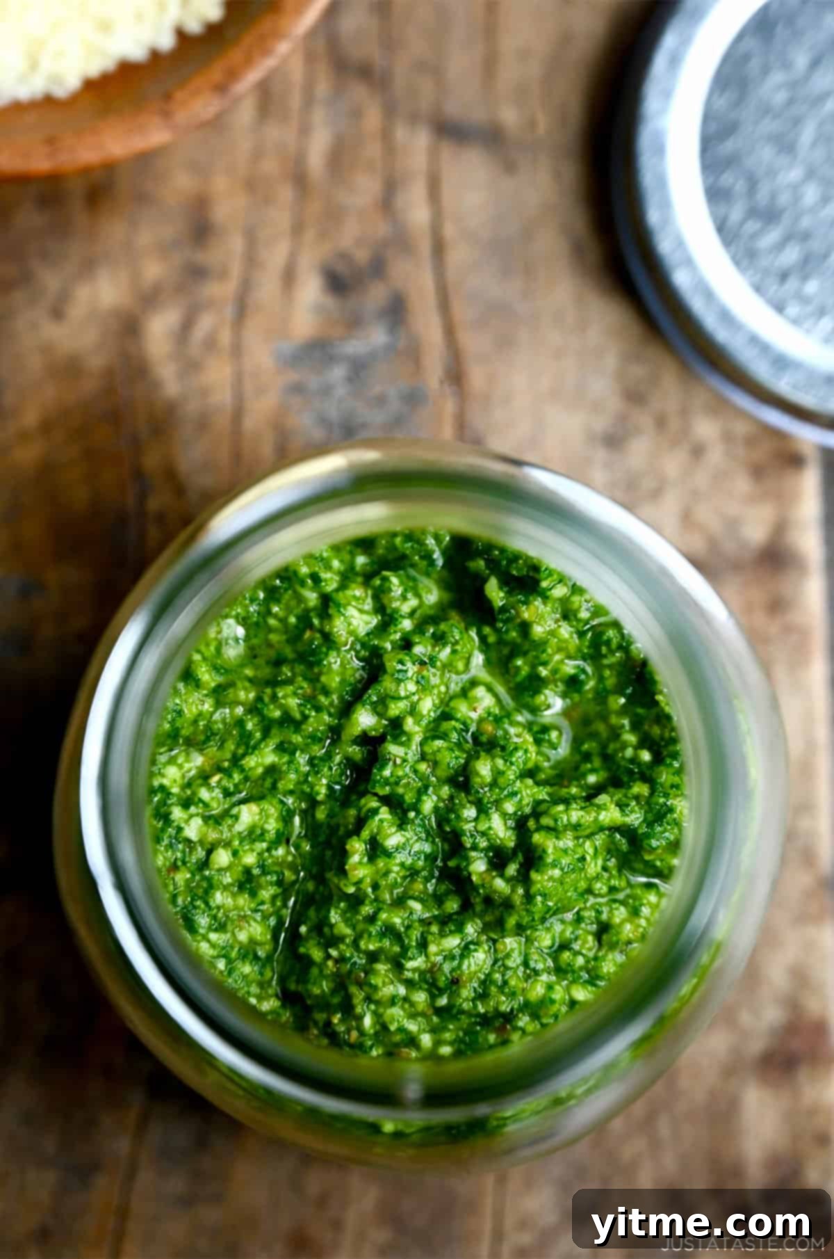 Simple Homemade Basil Pesto 6 Homemade basil pesto in a jar, showcasing its vibrant color.