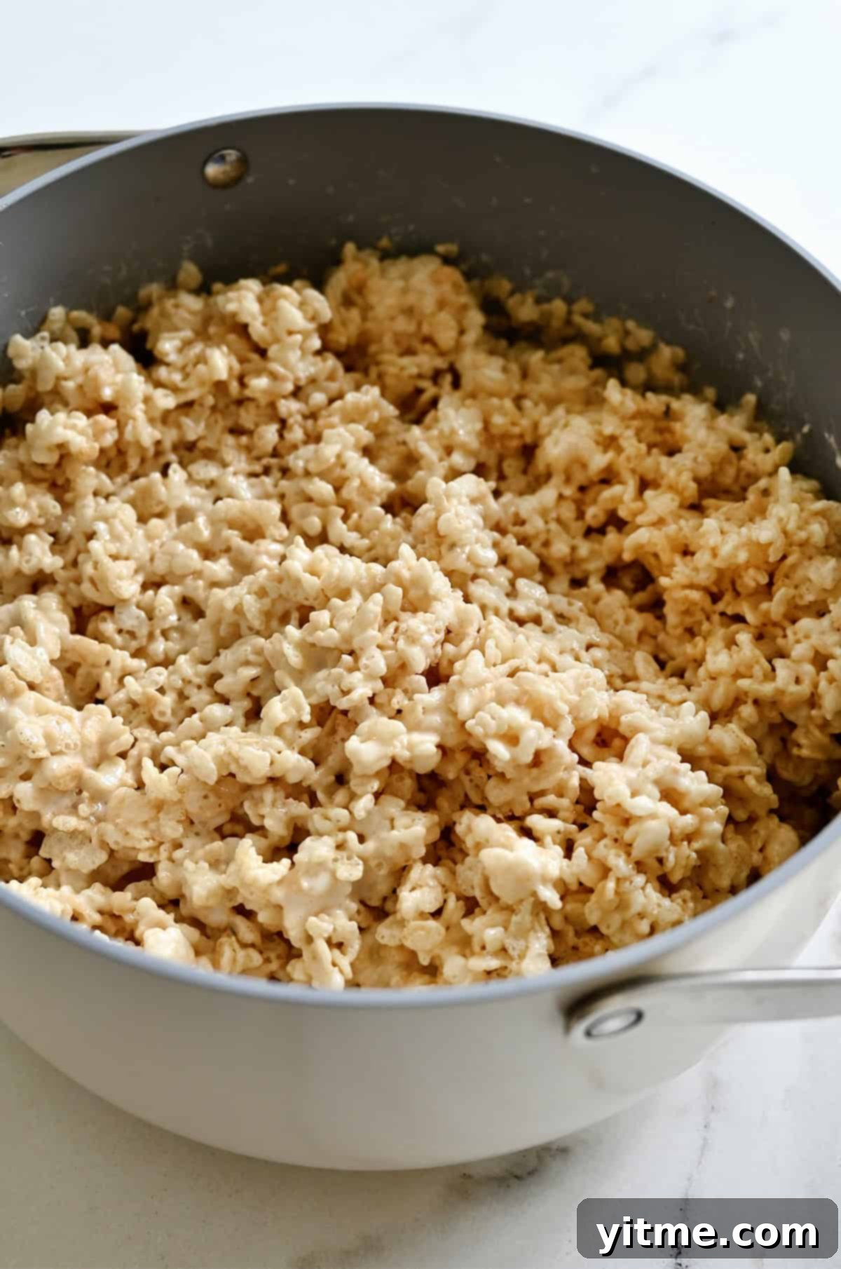 Rice crispy treats mixture in a stockpot.
