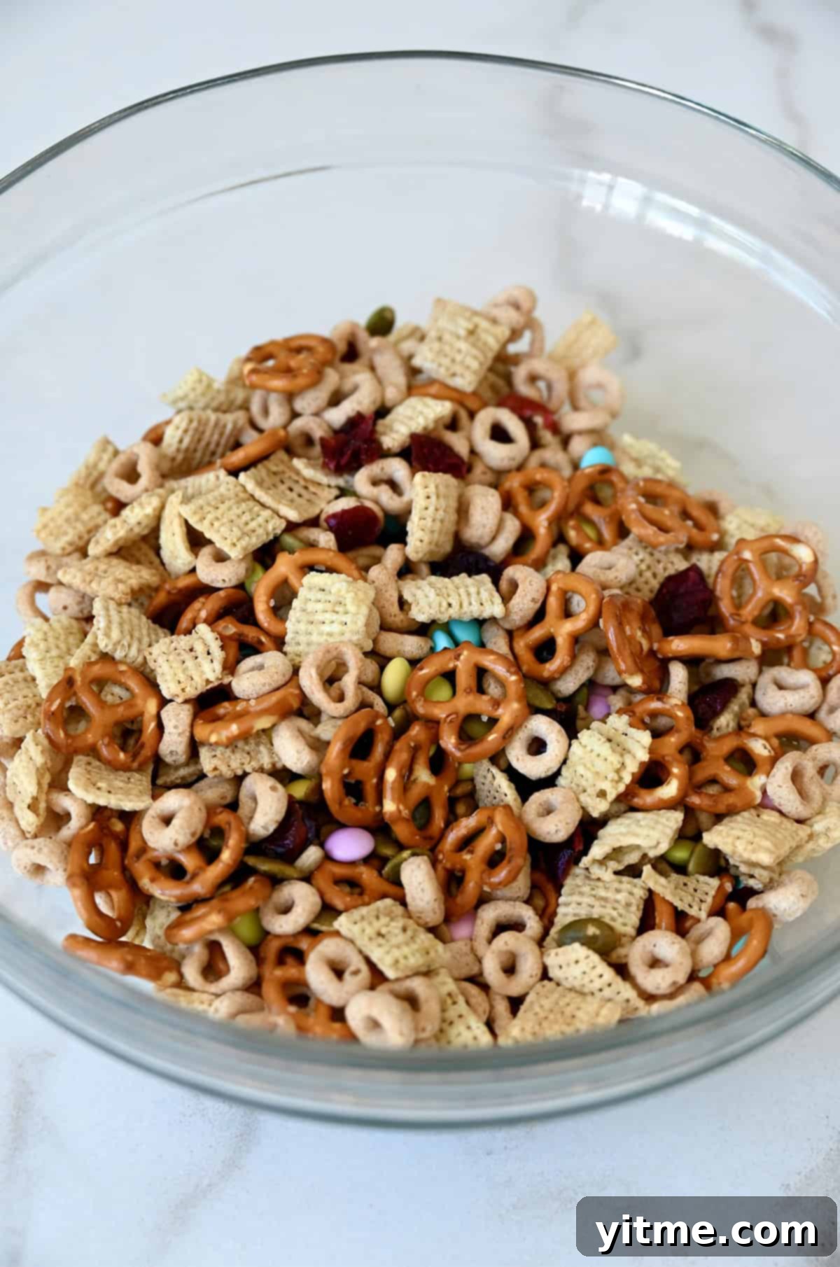Homemade trail mix without nuts in a glass bowl.