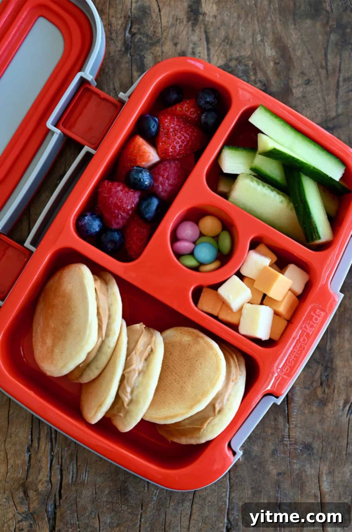 Cloud-Like Cottage Cheese Pancakes 12 A creative lunchbox featuring mini cottage cheese pancake sandwiches with a nut butter filling.