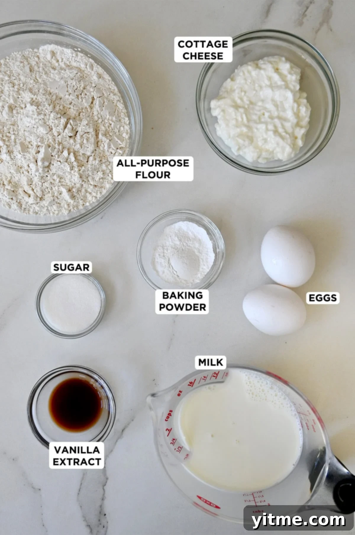 Cloud-Like Cottage Cheese Pancakes 3 A vibrant display of the essential ingredients for making delicious cottage cheese pancakes.