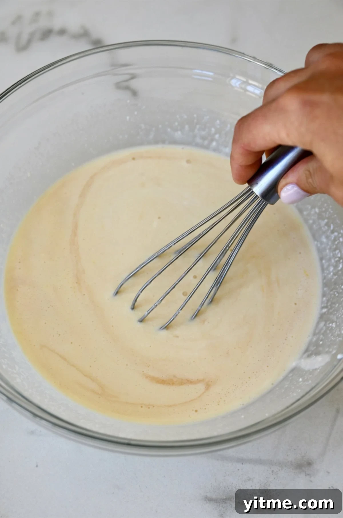 Cloud-Like Cottage Cheese Pancakes 5 Step-by-step instructions for making cottage cheese pancakes: whisking wet ingredients.