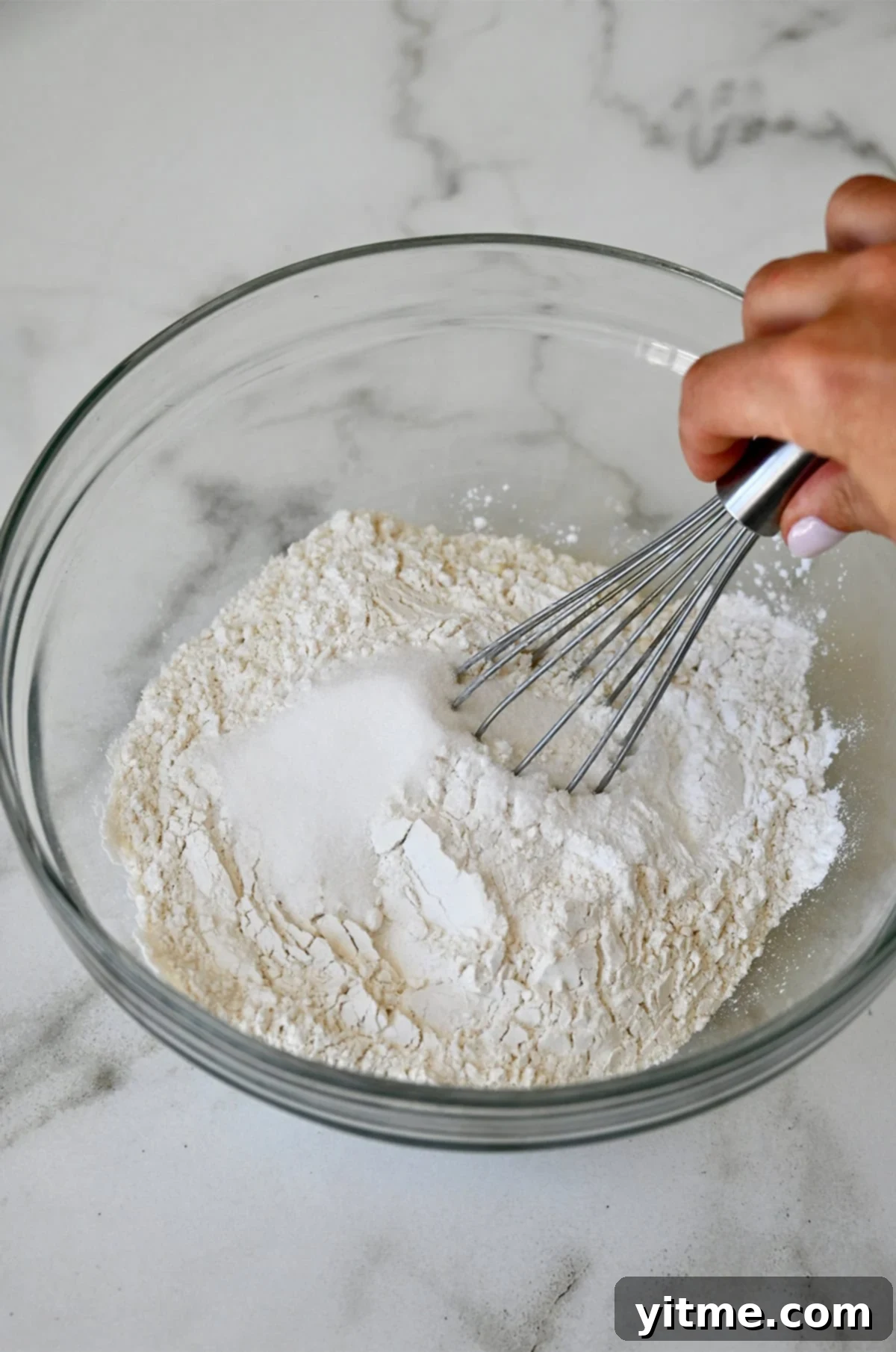 Cloud-Like Cottage Cheese Pancakes 6 Step-by-step instructions for making cottage cheese pancakes: whisking dry ingredients.