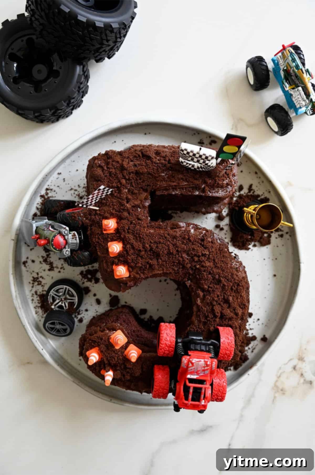 Happy 5-year-old Dean with his monster truck birthday cake