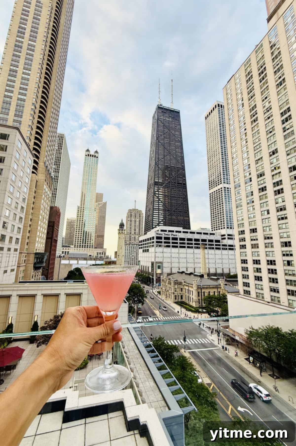 Kelly's elegant A.L.C. dress and gold clutch in Chicago
