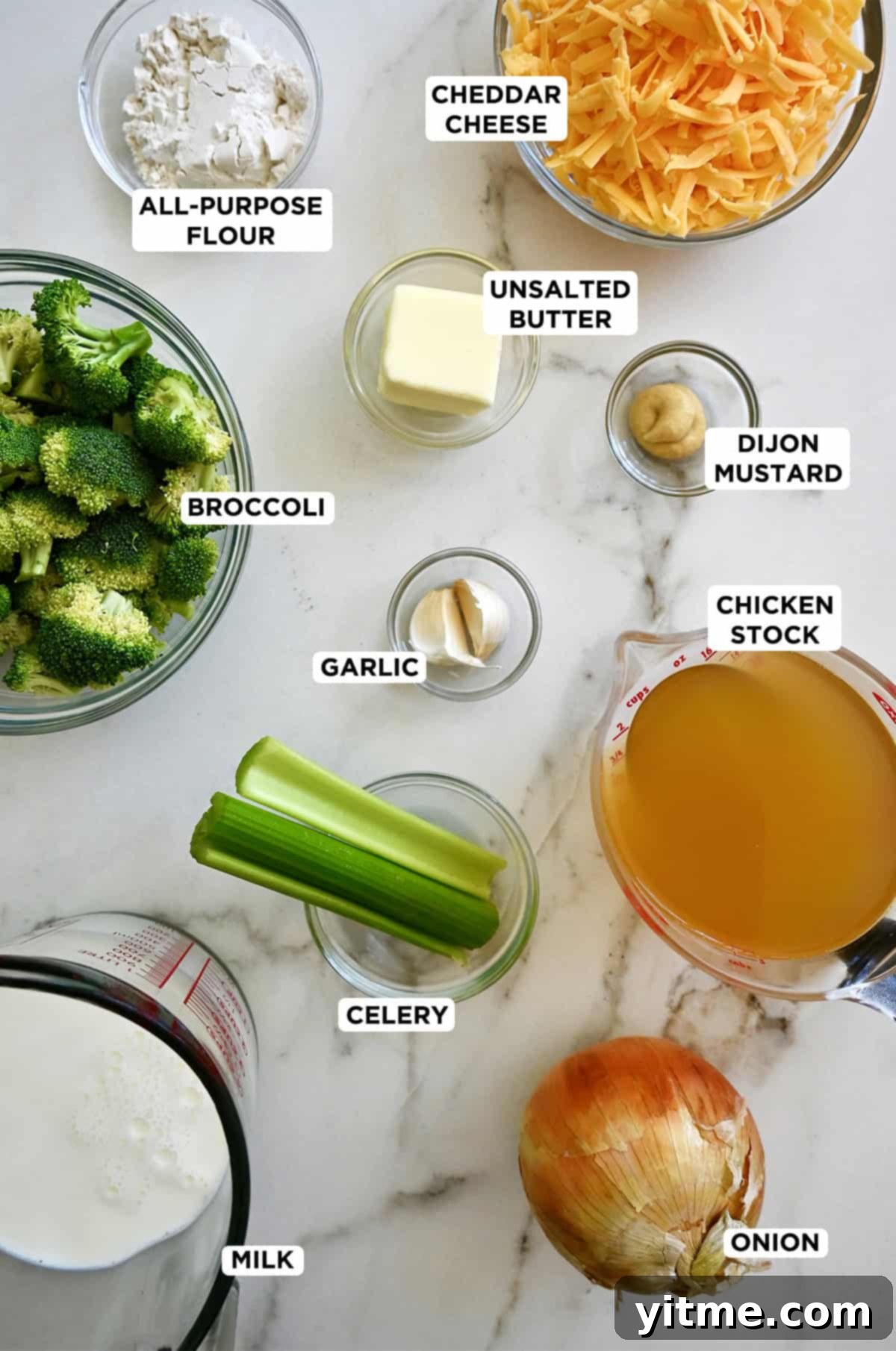 Creamy Broccoli Cheddar Soup 4 All the ingredients to make homemade broccoli cheddar soup are in various sizes of glass bowls.