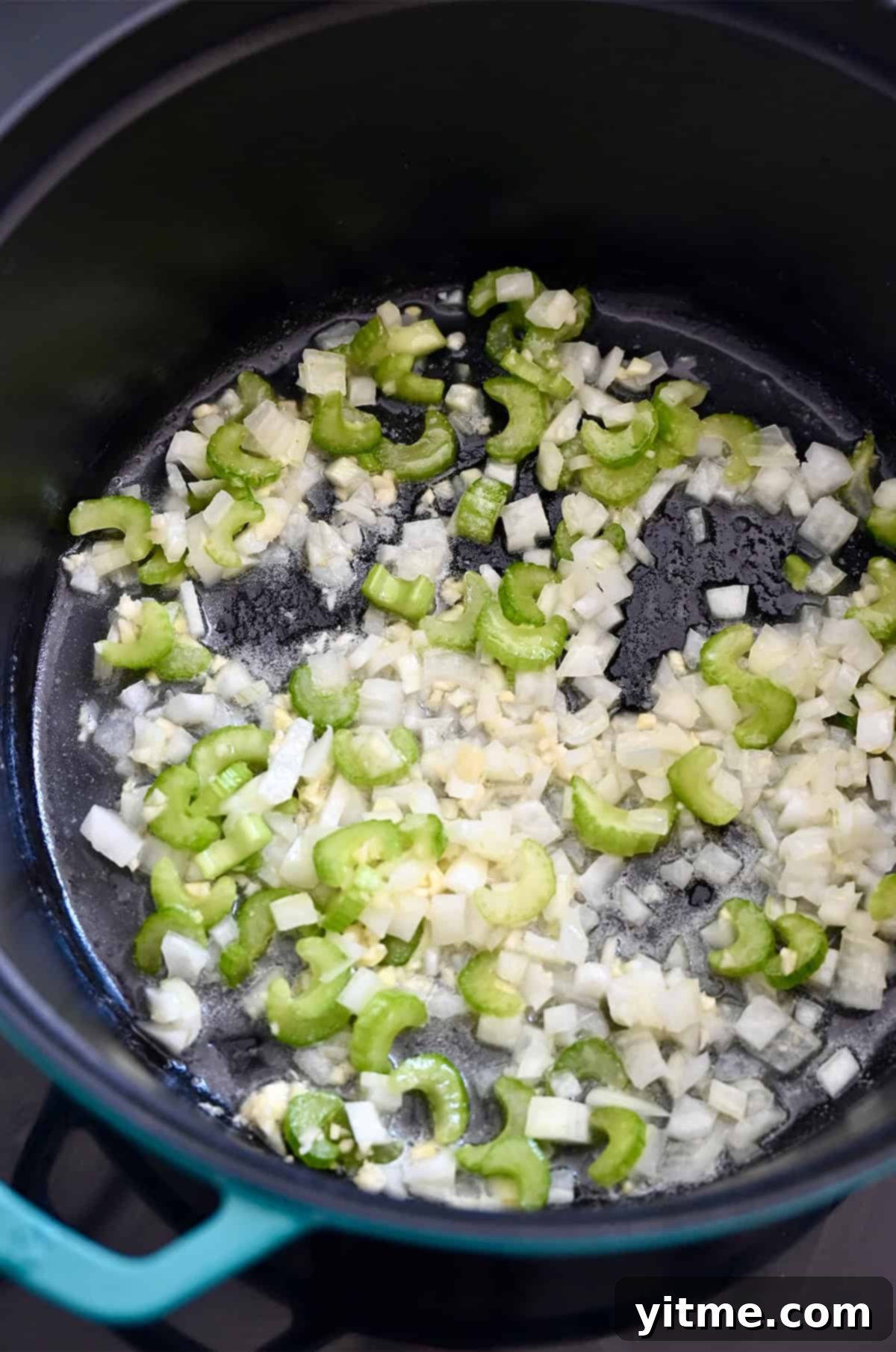 Creamy Broccoli Cheddar Soup 6 Onions, celery and garlic sautéing in melted butter in a large stockpot, the first step in making homemade broccoli cheddar soup.
