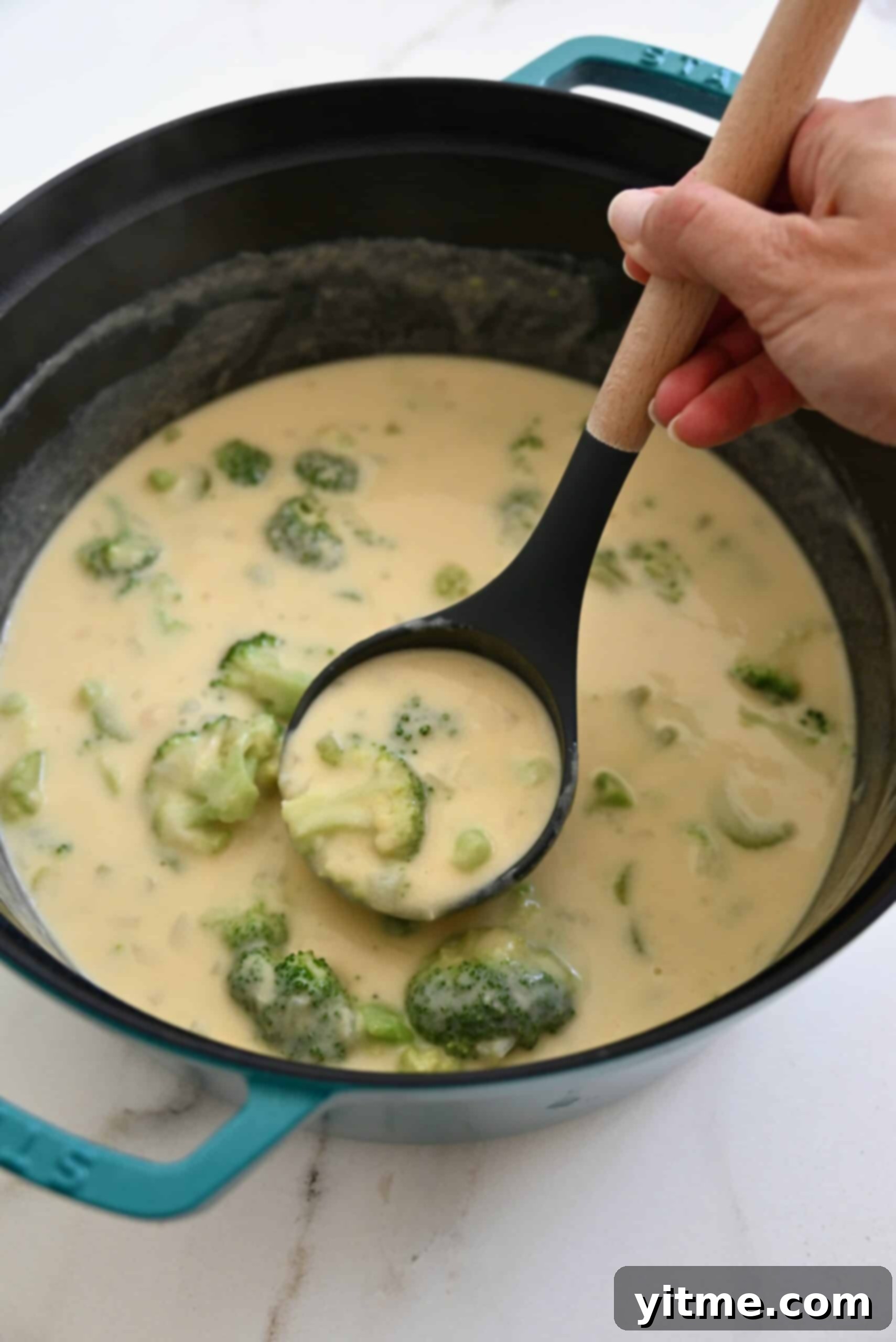 Creamy Broccoli Cheddar Soup 10 Cheddar cheese and broccoli soup in a stockpot before blending.