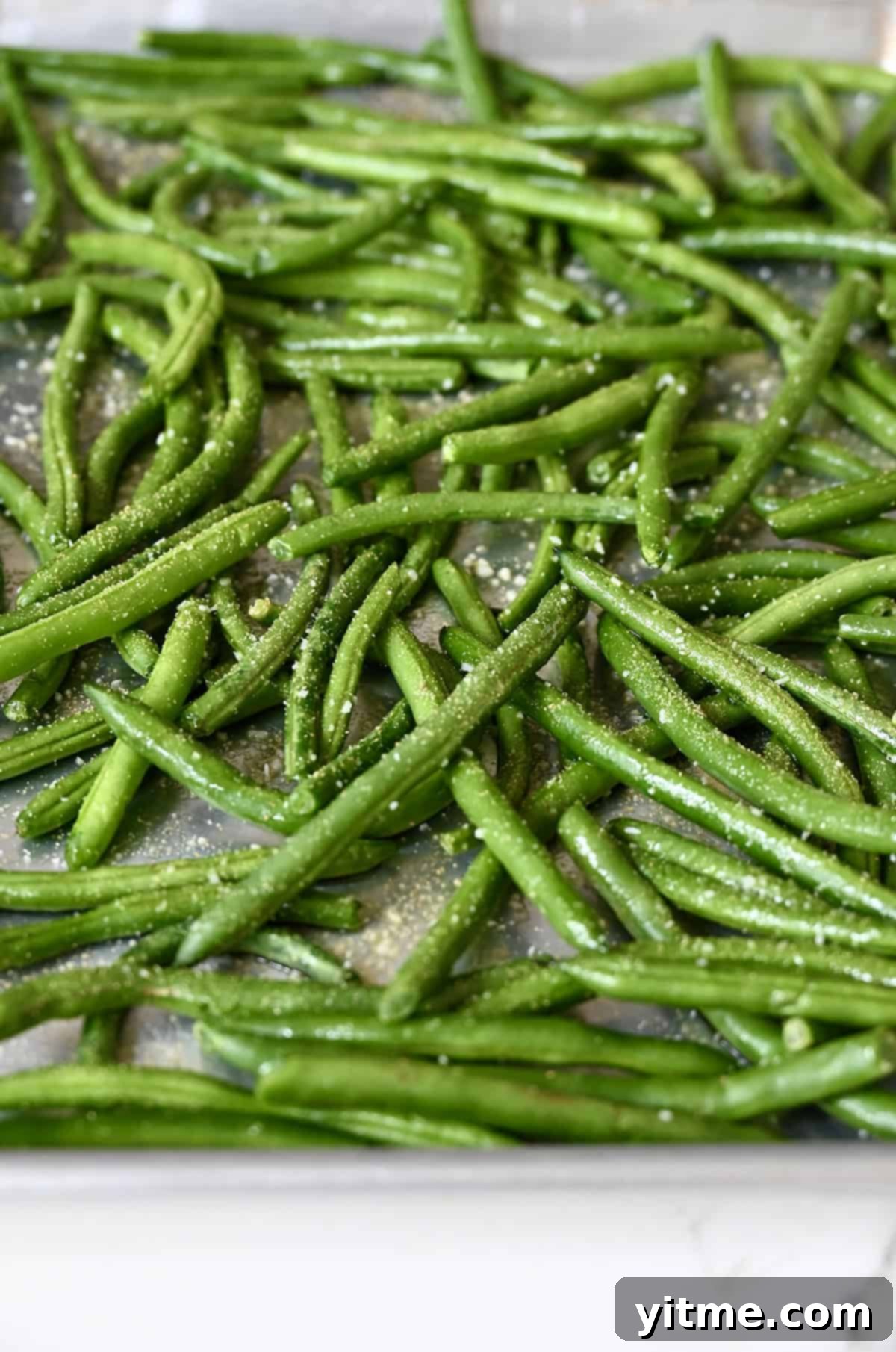 Green beans tossed with olive oil and seasonings