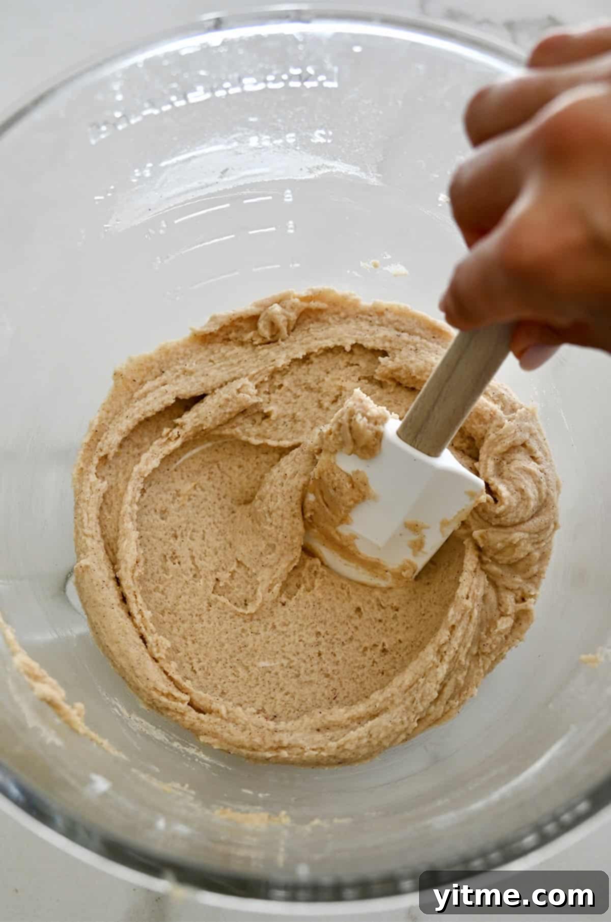 Chilled chai cookie dough in a glass bowl.