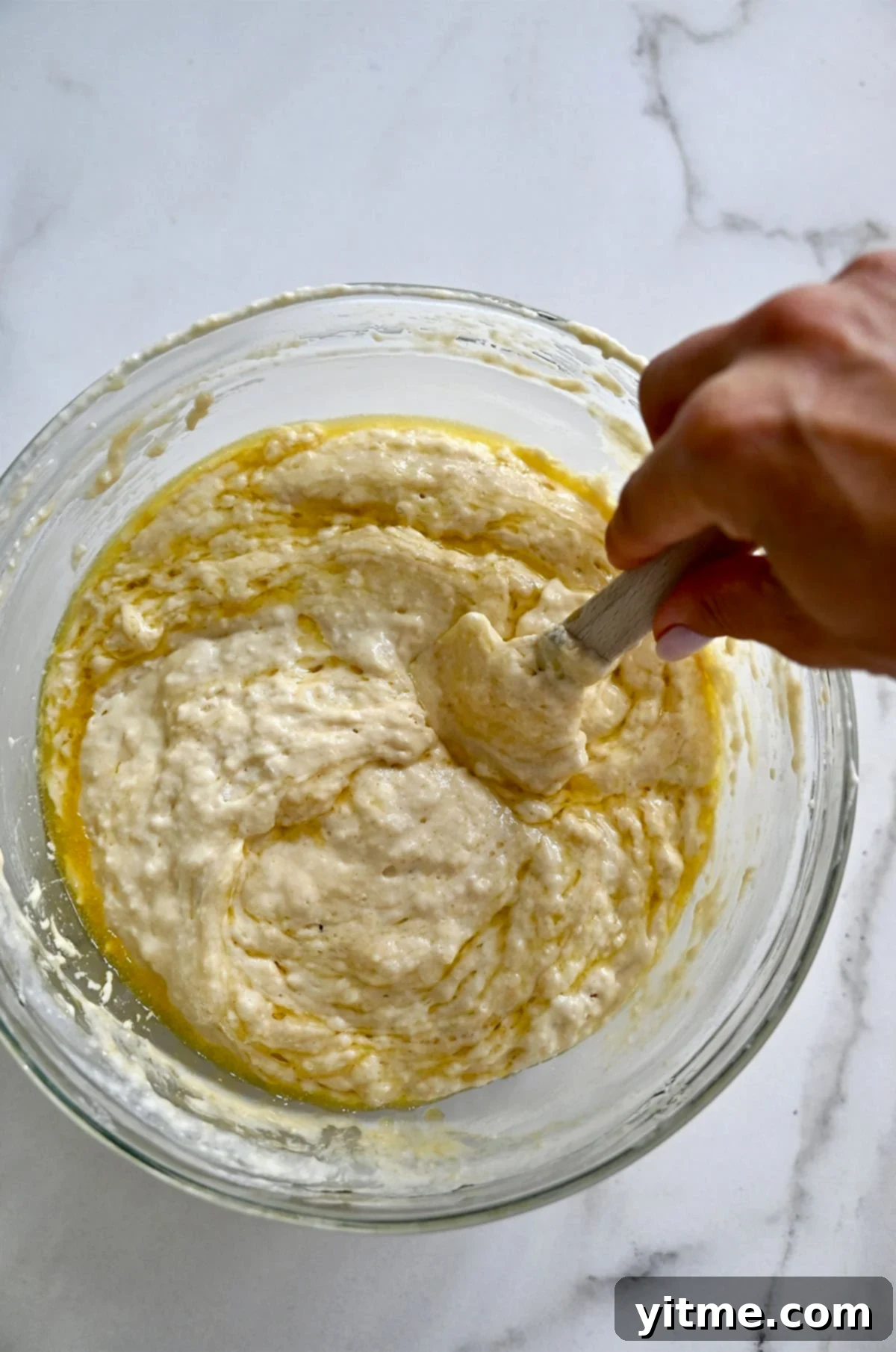 Protein waffle batter being stirred in a bowl