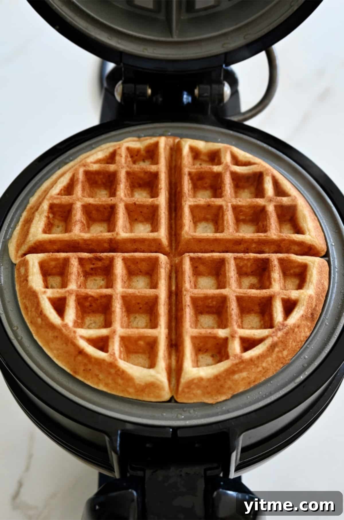 Golden brown protein waffle in a waffle maker