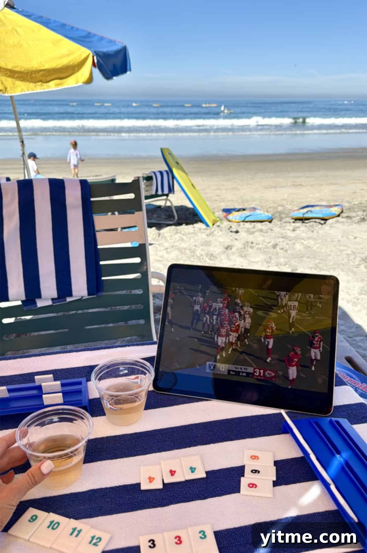 Beach setup with football and rummikub