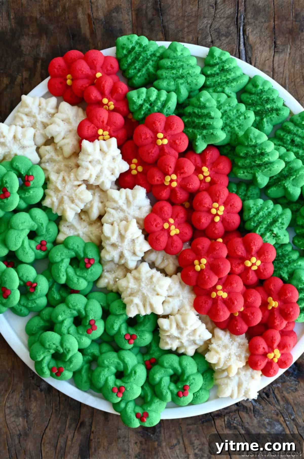 Buttery spritz cookies on a serving tray.