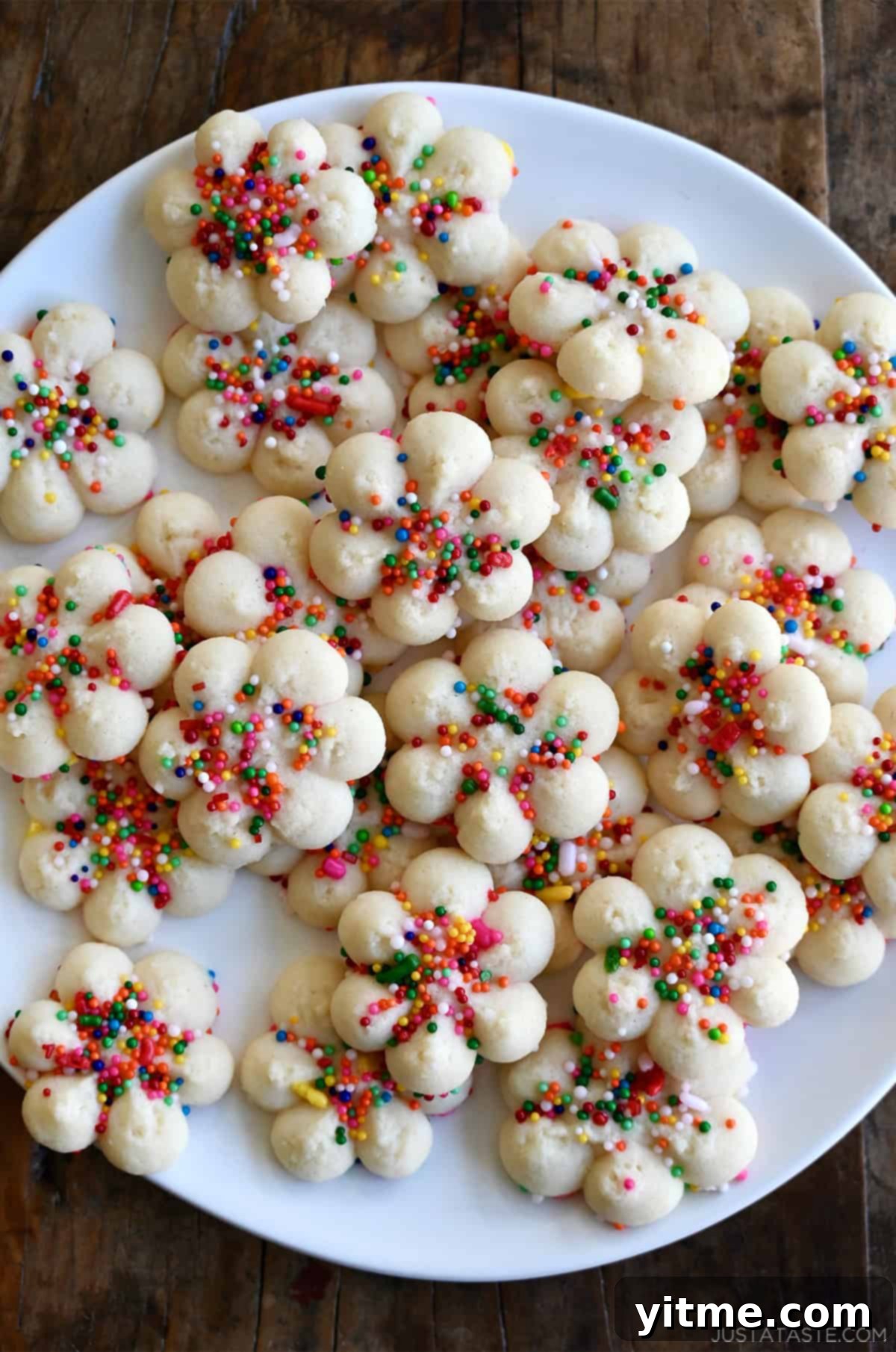 Buttery spritz cookies with rainbow sprinkles.