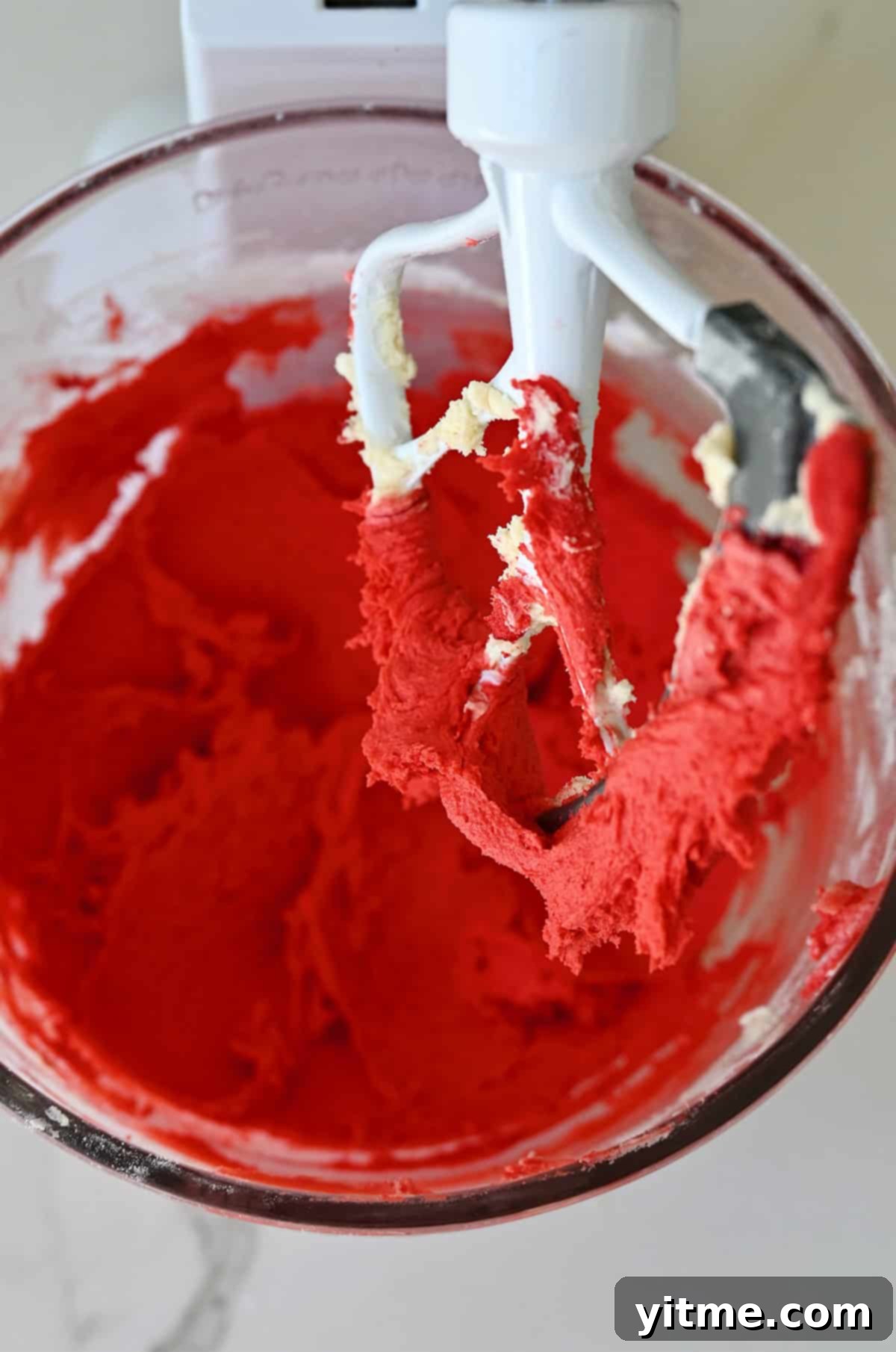 Red-colored spritz cookie dough.
