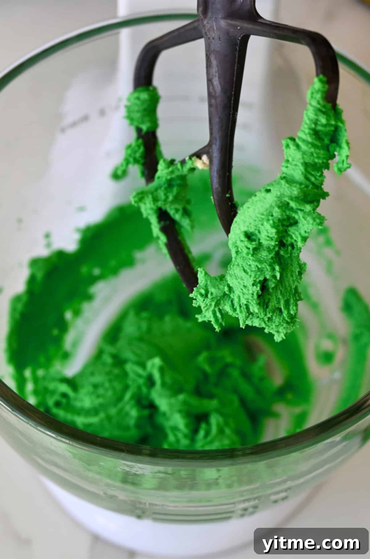 Green-colored spritz cookie dough.
