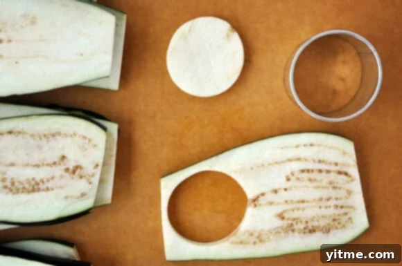 Close-up of crispy breaded eggplant rounds, prepared for Eggplant Parmesan Sliders.