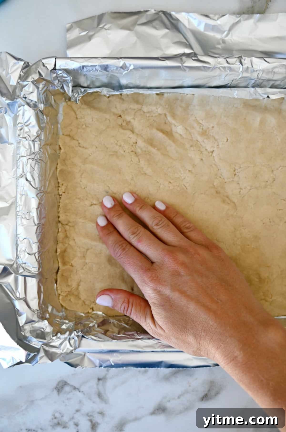 Pressing shortbread dough