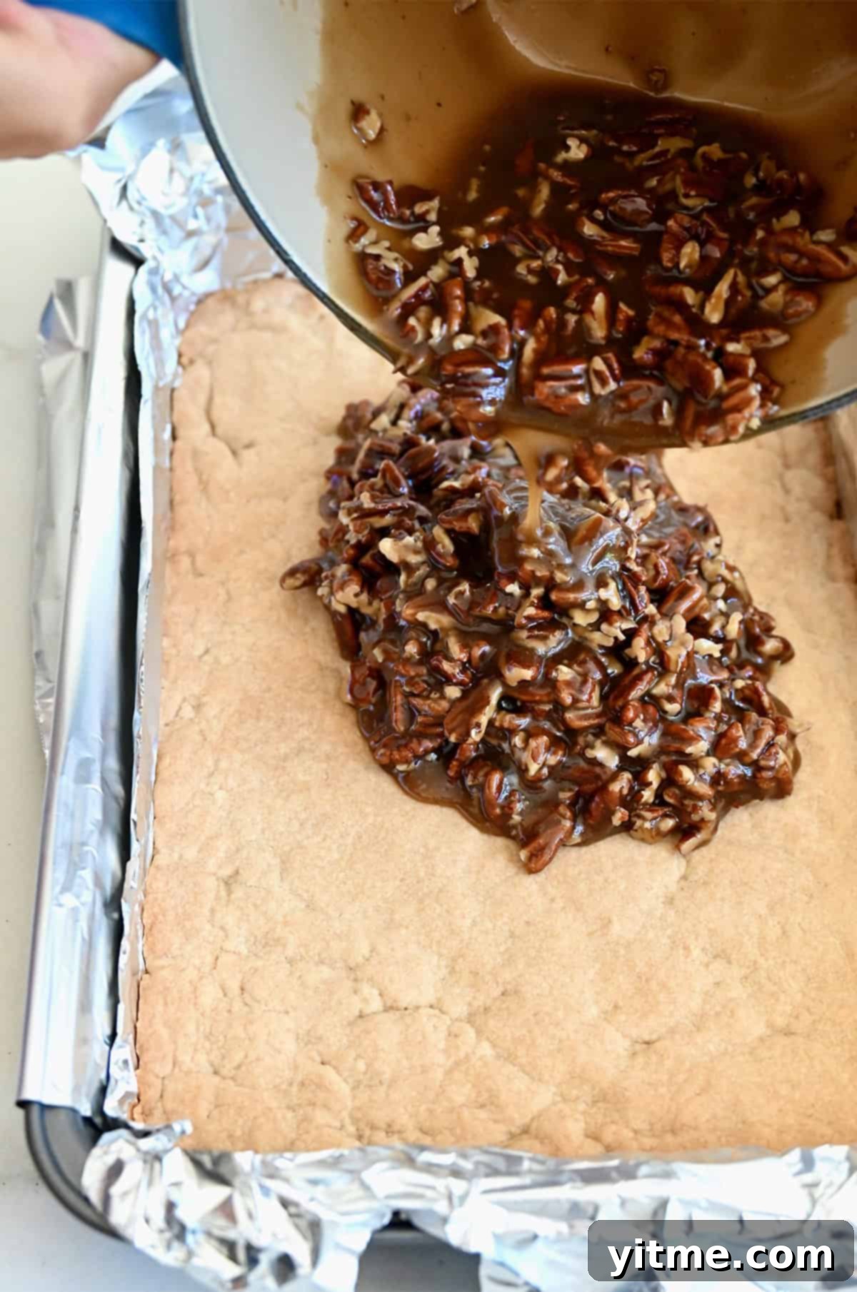 Pouring pecan pie filling