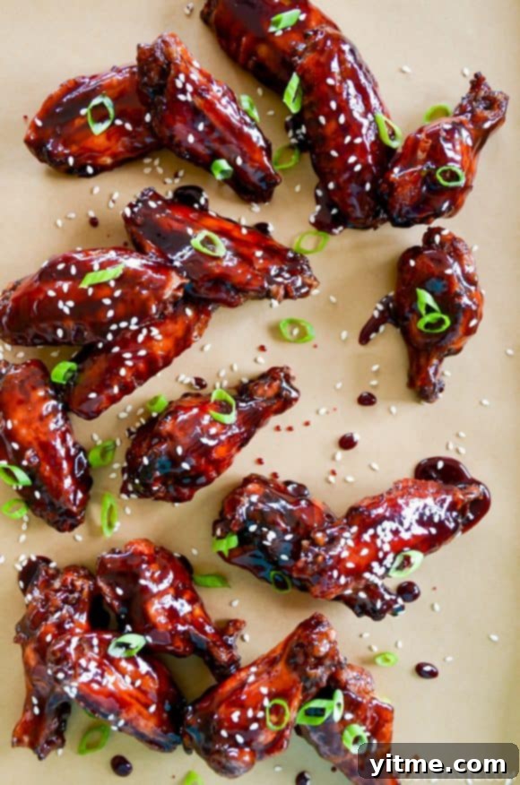 Crispy Baked Asian Chicken Wings topped with sesame seeds and chopped scallions